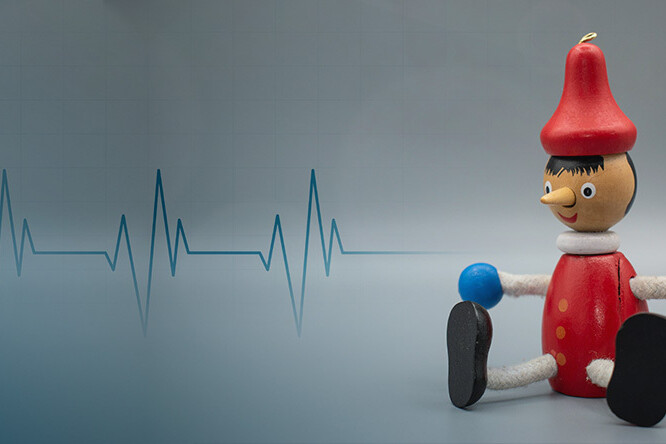 Pinnochio sitting with ECG signal