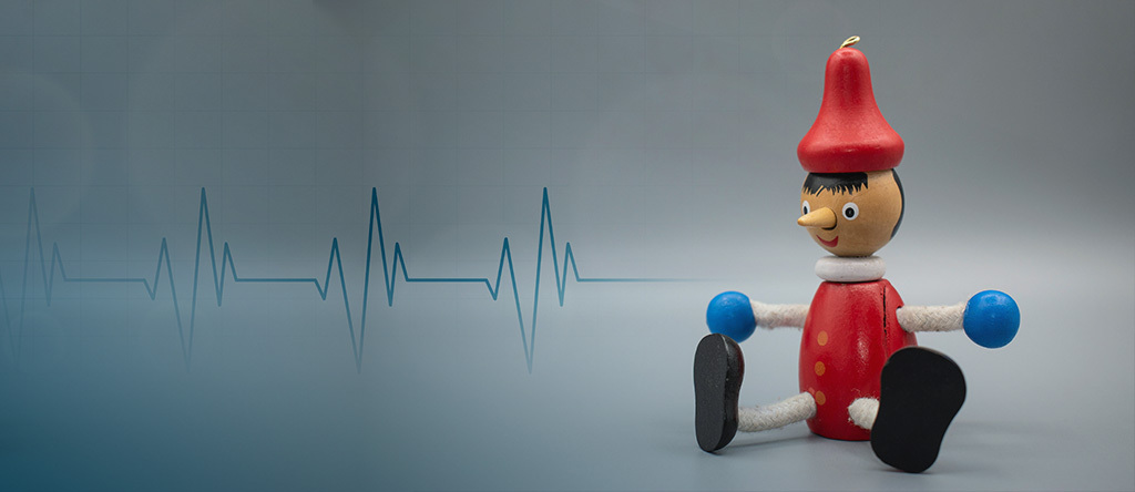 Pinnochio sitting with ECG signal